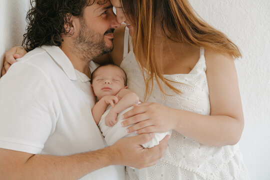 Happy Parents With Sleeping Infant