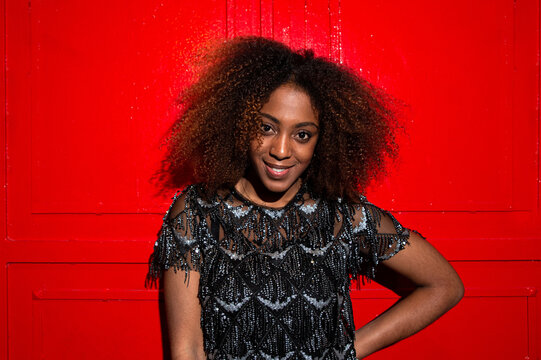 Smiling Black Woman In Trendy Dress During Party