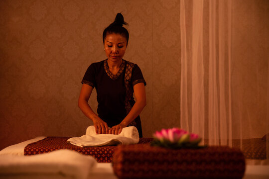 Thai woman decorating massage salon
