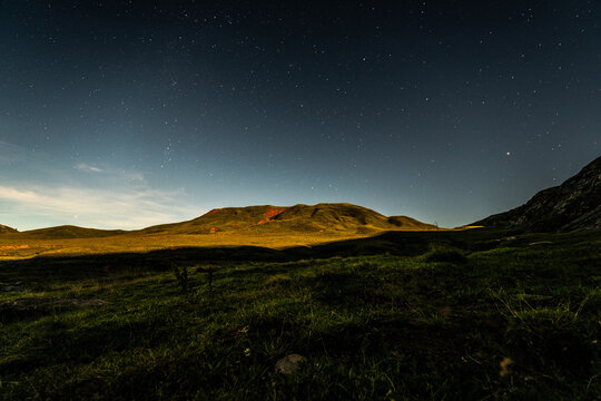 Starry Sky Over Mountains In Summertime