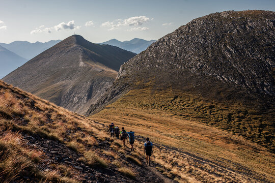 Backpackers walking through mountainous area