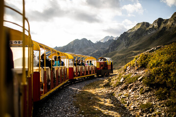 Train with tourists in mountains