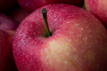 red wet apple with big droplet, macro shot