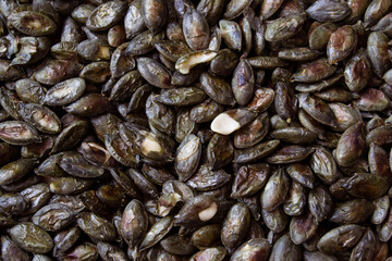 Cooked pumpkin seeds background or texture. Healthy food. Vegeterian and diet concept