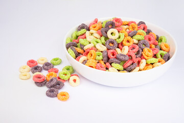 Multicolor loops breakfast cereal rings on the white background