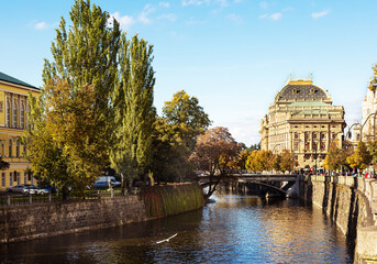 Fototapeta na wymiar View from the Jirasek bridge across the Vltava river to the National Theater in Prague. Autumn in the historical center of the capital of the Czech Republic.