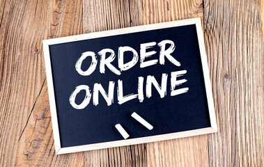ONLINE ORDER text on a chalkboard on the wooden background