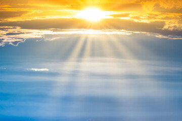 Sunset sky with sun rays and sunset clouds