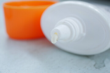 Close up of sunscreen cream in a pink container 