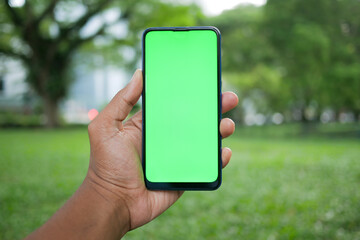 rear view of young man using smart phone at outdoor 