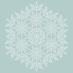 Round snowflake. Abstract winter ornament. Light blue and white snowflake