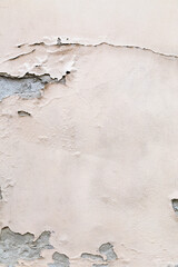 Abstract textured background graphic element. Peeling cream coloured paint on cracked concrete wall...