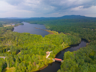Hancock Greenfield Covered Bridge aerial view on Cantoocook River with Powder Mill Pond between town of Hancock and Greenfield in New Hampshire NH, USA. 