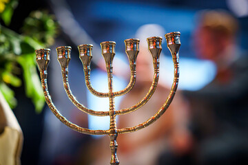Menorah in room with 7 arms Hanukkah symbol, selective focus
