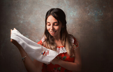 young chilean woman portrait with national costume or dress holding a scarf with chilean flag