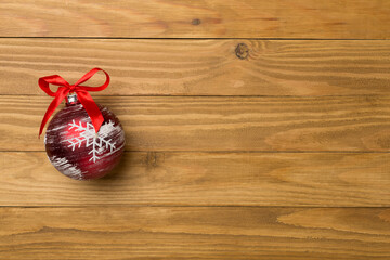 Christmas toy on wooden background, top view
