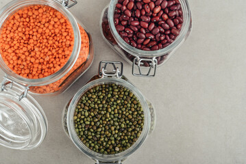 Mung beans, beans, red lentils  in glass jars