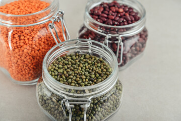 Mung beans, beans, red lentils  in glass jars