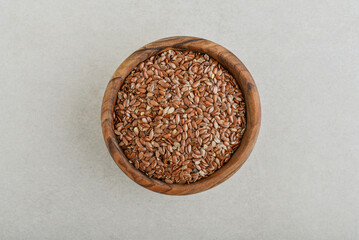 Flax seed in wooden bowl