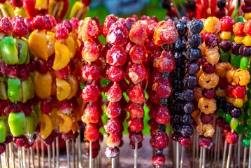 Photo sur Plexiglas Pékin Tang hulu or Chinese sugar-coated fruit stick. The snack of China in the Winter