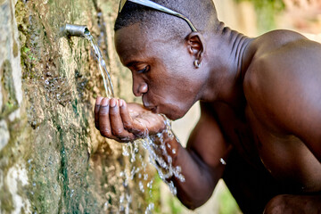 African American man drinking fresh water
