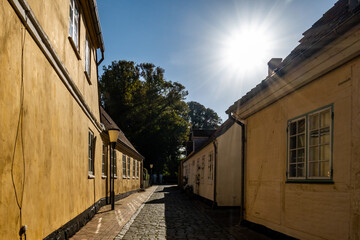 Maribo, Denmark  A cute back alley in the downtown with yellow houses.