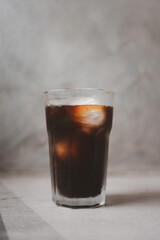 Iced americano in glass. Close up, coffee shot mix with water