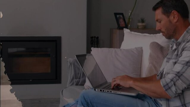 Animation of shapes over caucasian man using laptop