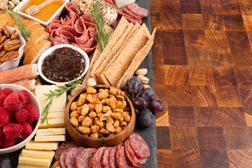 Meat Cheese and Fruit Charcuterie Board on a Wood Butcher Block
