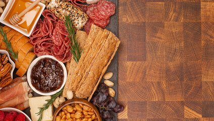 Meat Cheese and Fruit Charcuterie Board on a Wood Butcher Block