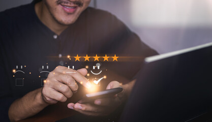 smart businessman use smartphone choosing happy smile face icon. feedback rating and positive customer review experience, satisfaction survey. world mental health day concept. soft focus.