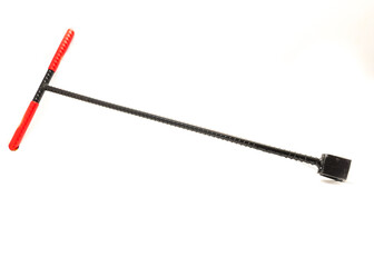 Steel heavy duty street and curb water meter key with red t-handle covered with vinyl to open and close meter valves isolated on white background