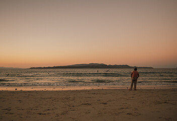 Men watching sunset, Tecolote, Baja California, Mexico