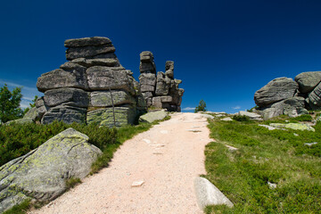 Rock formation Three pigs - stones in Poland. Krkonose.