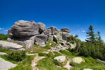 Rock formation Three pigs - stones in Poland. Krkonose.