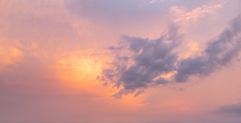 orange gold sunset ,dramatic fluffy clouds at pink evening sky nature landscape