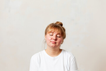 Portrait of  blonde girl in  white T-shirt