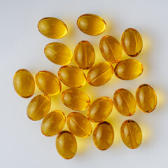 fish oil in omega 3 capsules on a white background