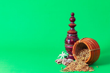 Laxmi puja essentials for rituals kept together. rice paddy grains and other objects symbolizing...