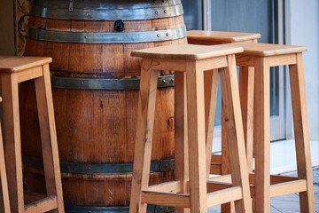 Stools and table on the terrace of a bar