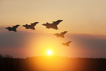Air Force Day. Aircraft silhouettes on background of sunset or sunrise.