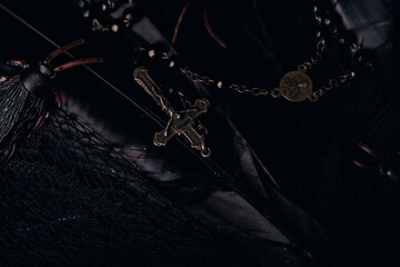 Voodoo Magic concept. Voodoo doll studded with needles with pierced rag heart on pentagram and...