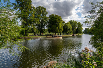 small pleasure cruise boat on the River Avon in Stratford on a beautiful summer day