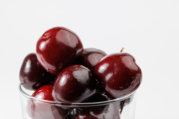 A few delicious cherries on white background.