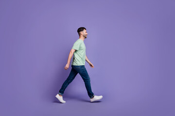 Fototapeta na wymiar Full length profile side photo of cheerful man stylish clothes empty space hurry store black friday isolated on purple color background