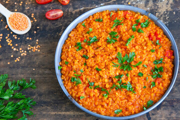 Red lentil dish with tomatoes and peppers. Vegetarian cooking
