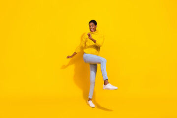 Fototapeta na wymiar Full length body size view of attractive cheerful skinny girl dancing having fun good mood isolated over bright yellow color background