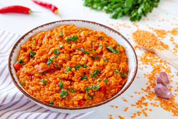 Red lentil dish with tomatoes and peppers. Vegetarian cooking
