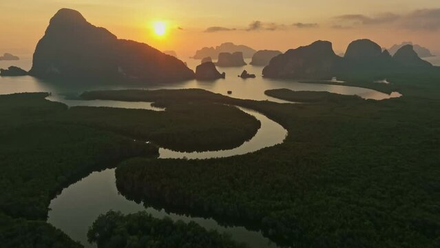 Aerial view drone flying to the sea sunrise over mountain, Phang nga, Thailand
