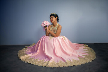 Beautiful woman in dress - princess pink costume. blur background with space for text